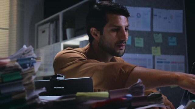 office employee searching and arranging documents with files and paperwork on Desk