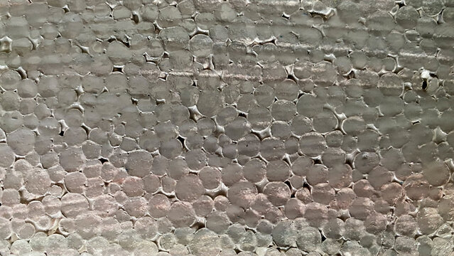 Close up macro texture of grey painted styrofoam background