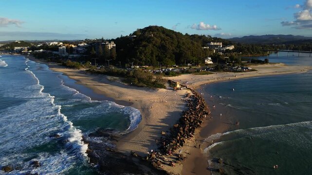 Aerial dolley out shot of Currumbin Rock, QLD 