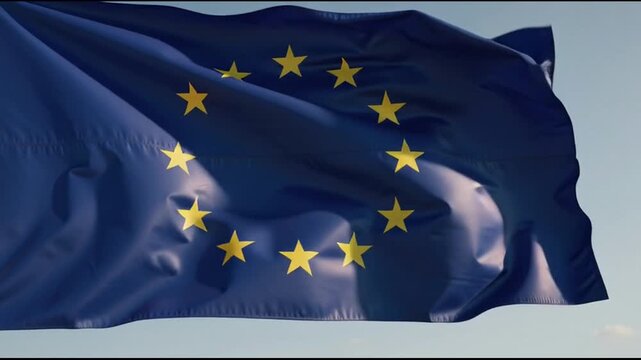 European Union flag waving freely outside.
