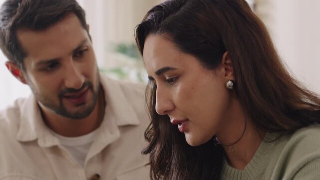 Supportive console couple in emotional moment at home as woman struggles with sadness and stress, expressing