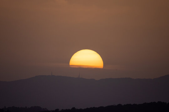 setting sun behind the Tramuntana mountain range in Mallorca