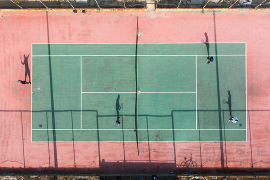Aerial top view of a tennis court with four players, Recife, Pernambuco, Brazil