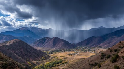 Fototapeta premium Dramatic Mountain Landscape with Storm Clouds and Rain Showers Over Valley Surrounded by Peaks, Offering a Breathtaking Natural Scene