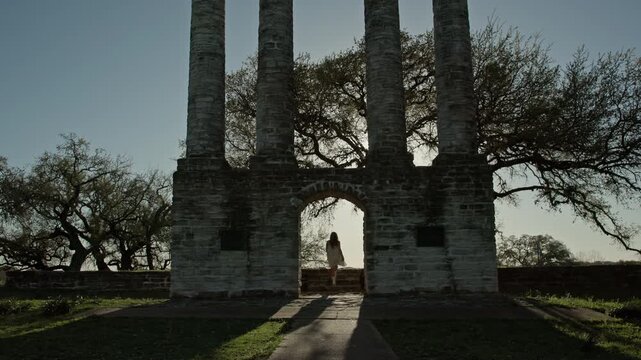 Woman Wandering Around Deteriorated Stone Ruins and Historic Architecture In Old Bailey Chimney