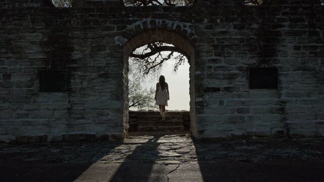 Girl Walking Through Historic Building Ruins in Old Bailey Park
