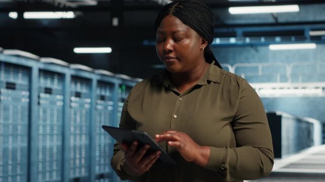Admin works inside a data center to support equipment checkups, network monitoring, workload capacity and organized technical operations within a practical data center workflow.
