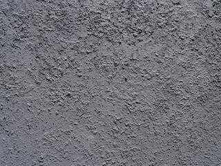 Obraz premium Rough concrete wall texture background with coarse stucco cement finish for industrial interior design or architecture backdrop