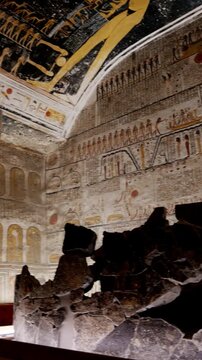 Broken stone sarcophagus of an ancient Egyptian pharaoh Ramesses inside a royal burial chamber of royal tomb KV 9, Valley of the Kings, Luxor, Egypt.