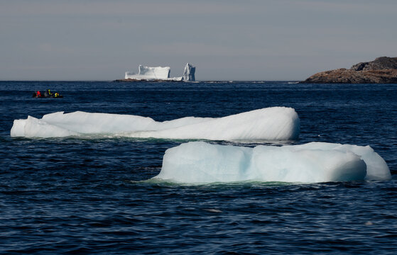 Tour boat observes massive icebergs floating at sea in Newfoundland