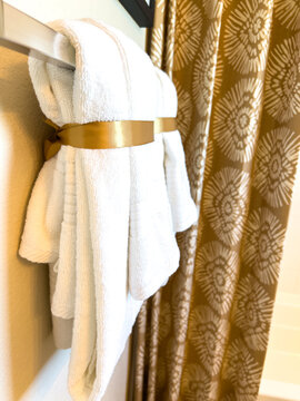 White Bathrobe Hanging on Chrome Hook