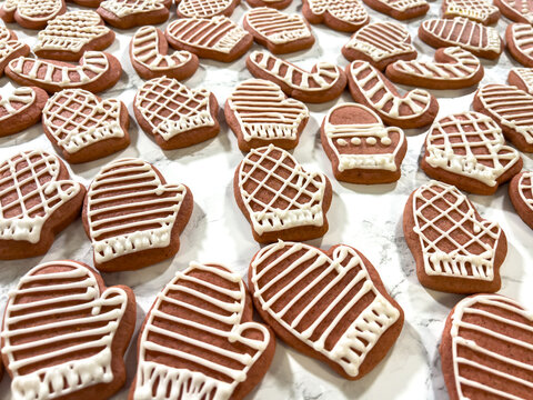 Mitten cookies arranged on parchment paper