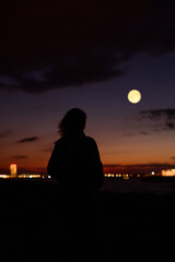 Fototapeta premium Woman observing stars, planets, Moon and other celestial objects.