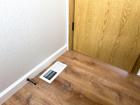 New Flooring with Vent in Home Remodel