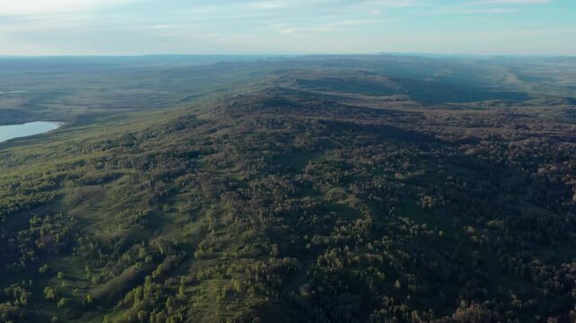 Southern Urals in spring: Irendyk ridge and Talkas Lake at sunset.