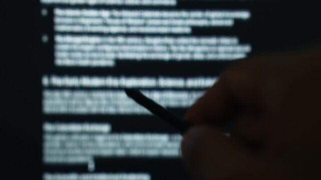 Hand holding a stylus pen pointing at an AI algorithm processing screen for data analysis, representing machine learning, intelligent automation, digital analytics, and smart decision making. 4k.
