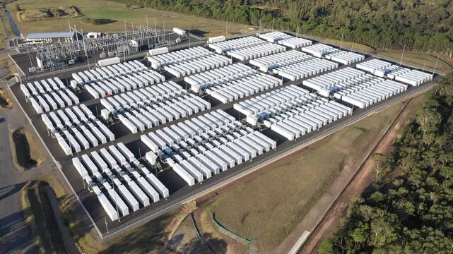 Slow aerial circle of the Waratah Super Battery at Colongra, NSW, Australia. This battery energy storage system has a continuous power output of up to 850MWh at completion in 2025.
