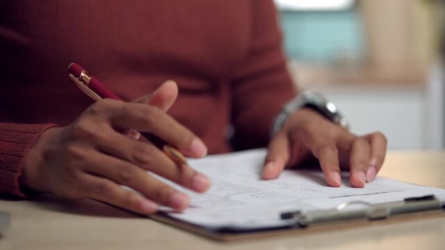 Professional close-up of a woman signing an approval document related to a business agreement. Suitable for themes of legal consent, official confirmation, corporate administration, and financial pape