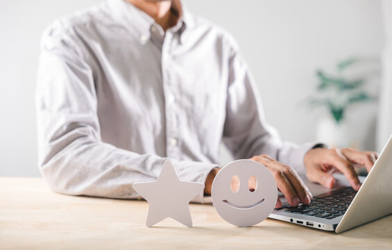 Customer feedback concept shows positive satisfaction, business person provides online review, happy client experience with quality service evaluation, five star rating
