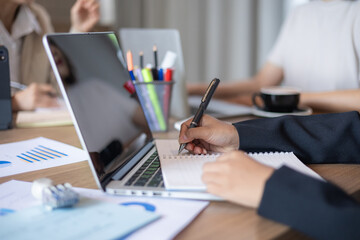 Fototapeta premium Group of business women are brainstorming sales strategies in the office conference room