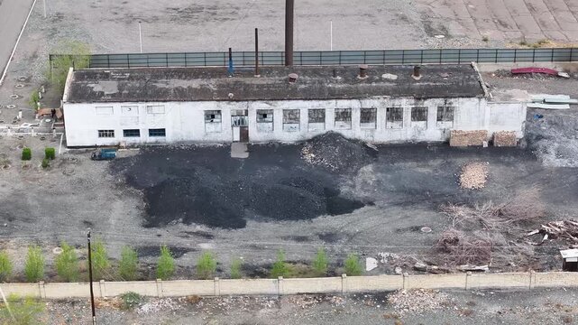 Aerial of old abandoned factory from Soviet era in Balykchy town, Kyrgyzstan, industrial