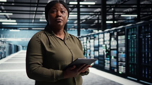 Woman stands in a digital media setting where screen content suggests streaming videos, social media videos, personalized recommendations and evolving viewing habits.