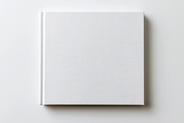 Fototapeta premium The White Notebook Flat Lay on Minimalist White Background with Subtle Shadow