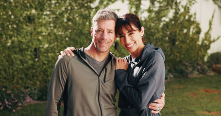 Fototapeta premium Smile, couple and hug in backyard for fitness, love and partner support for health benefits. Portrait, mature people and embrace at house for pilates, morning hobby and bonding together for wellness