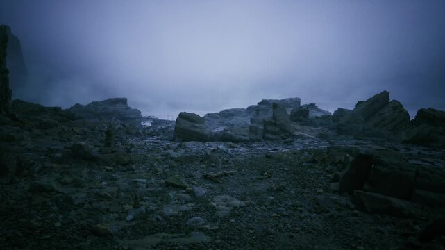 Gloomy rocky plain with silence. Somber stony terrain beneath chilling overcast sky. Forbidding rugged surface under frigid cloudy sky with sparse rocks