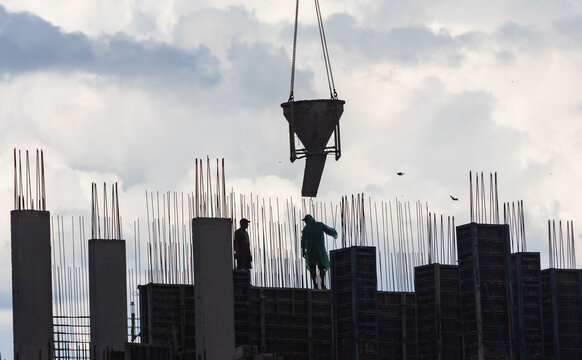 Construction Workers Pouring Concrete In Ukraine