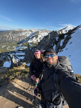 Happy couple hikers selfie at Spitsy rock formations Carpathian mountains