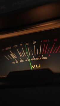 Vertical video Analog VU meters on classic hi-fi reel-to-reel tape recorder. Retro sound level meter decibel meter in studio, vintage audio equipment.