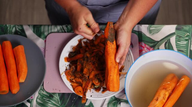 A step-by-step guide to peeling carrots on a patterned kitchen counter using a wooden peeler, demonstrating practical everyday cooking techniques. The video features vibrant orange and lush.