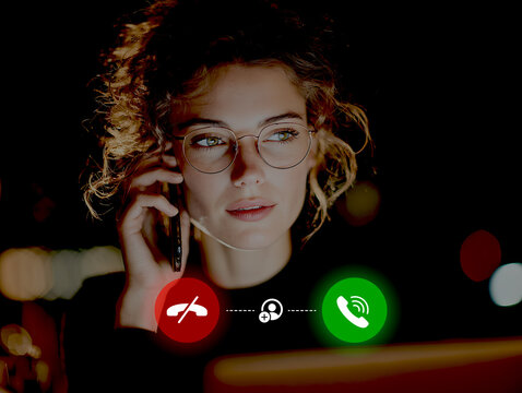 A businesswoman is holding a smartphone with icons indicating whether to answer or reject a phone call.