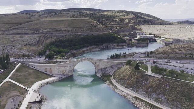 Cinematic View of Malabadi Bridge in Diyarbakir, Turkiye &ndash; Medieval Stone Arch Bridge Above Batman River