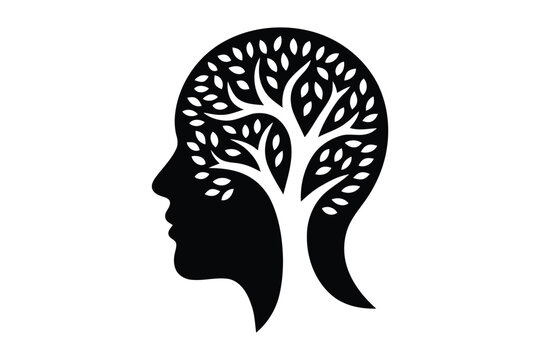 Human head silhouette with a tree inside representing mental growth and nature