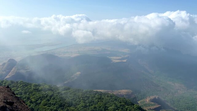 Pimpalgoan joga Dam with cloud movement seen from Taramati Peak, Western Ghats of India.