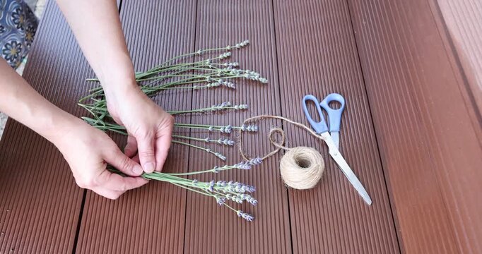 Handmade florist hands making lavender bouquet video clip. Aesthetic organic crafting process tutorial backdrop. Minimalist cottagecore DIY lifestyle content creator trend.