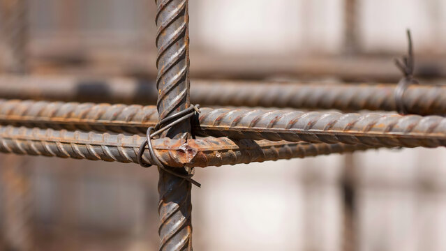 Reinforced steel bars tied together with wire for building construction