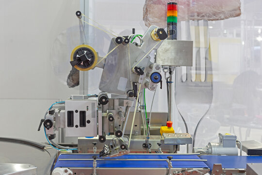 Automatic Labeling Machine Conveyor Belt in Food Production Plant