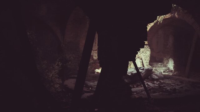 Ruined stone vault soaked in light revealing collapsed arch and scattered rubble, deep pockets of shadow framing textured bricks, dust motes suspended in warm