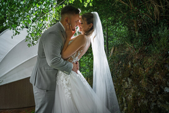  happy, laughing bride and groom at the wedding. Celebrate an emotional wedding.