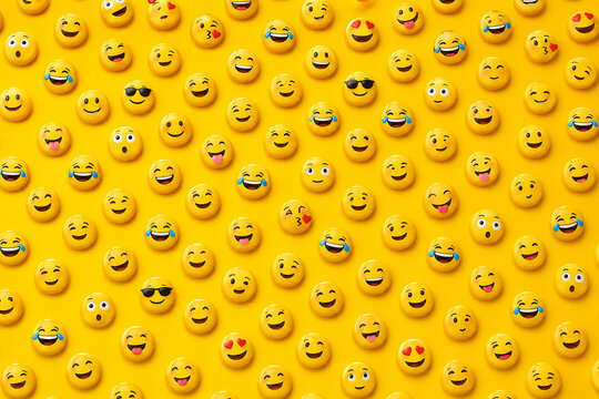 Seamless pattern of colorful 3D emoji faces on vibrant yellow background, playful social media texture and cheerful wallpaper