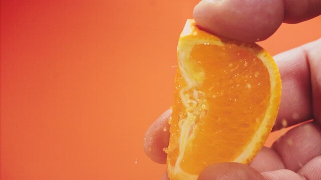 Squeezing out fresh orange juice super slow motion 1000 fps