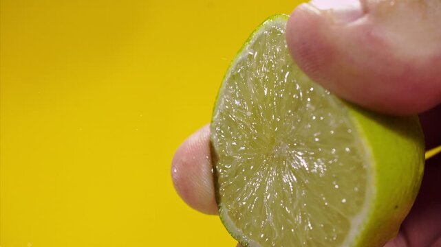Squeezing out fresh lime juice at super slow motion at 1000 fps