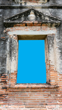 Old antique brick window frame with isolated blue background for photo compositing, Old antique brick window frame with clipping path.