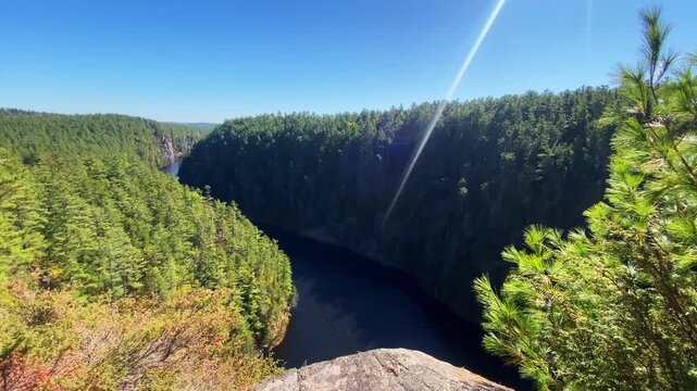 Wide view of Barron Canyon in Algonquin Park, showcasing the dramatic depth of the canyon and forested cliffs stretching into the distance.