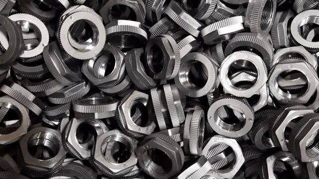 Static macro video of industrial plastic parts background. Stack of manufactured components, polymer textures and factory production concept. 