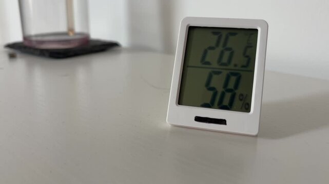 Indoor Digital Thermometer Showing 26 Degrees Celsius And 58 Percent Humidity