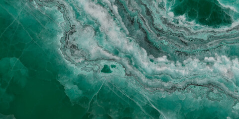 Elegant emerald green onyx marble texture with translucent layers and natural stone veins. © Vidal